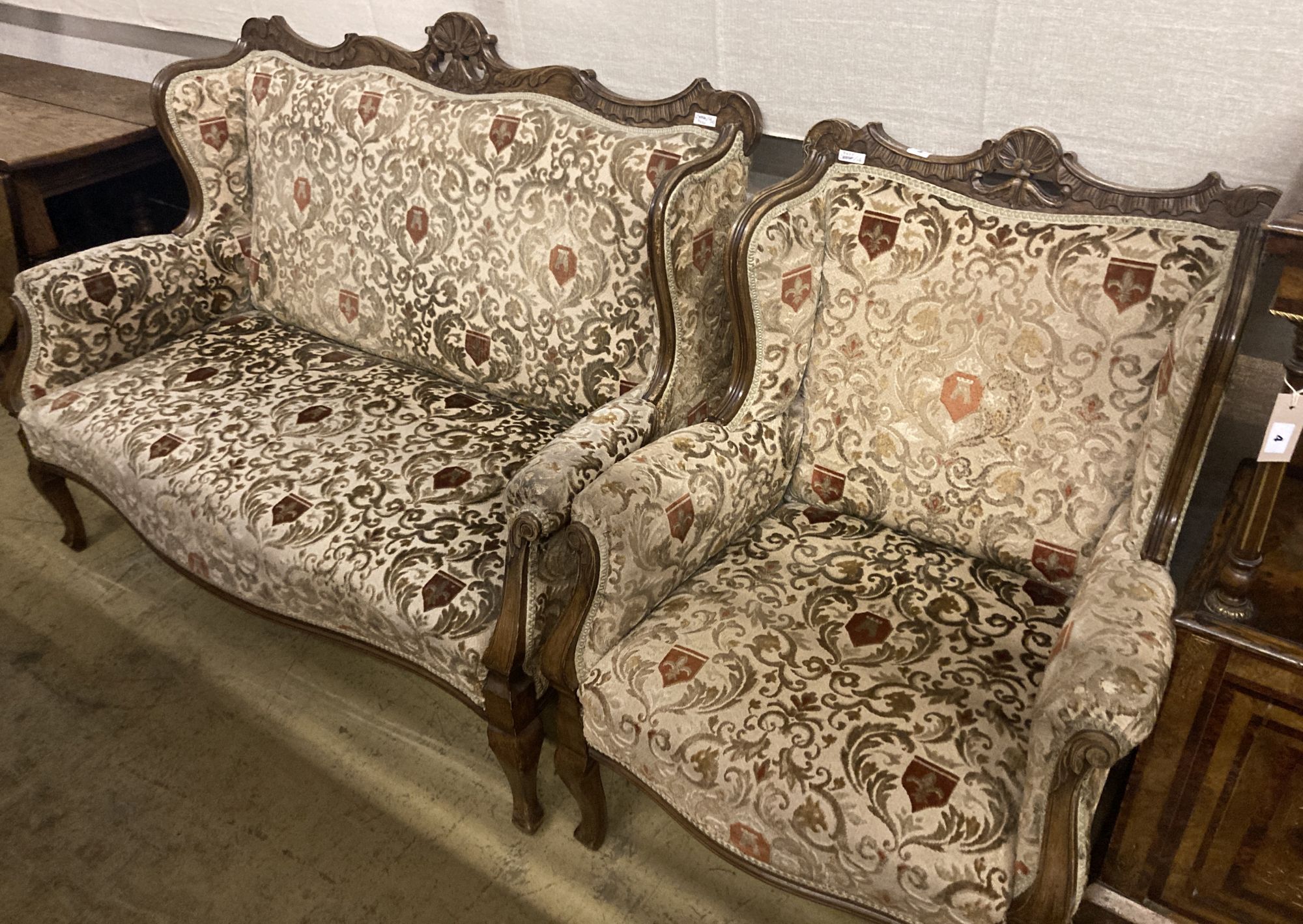 A late Victorian upholstered beech settee and armchair, settee width 130cm depth 66cm height 100cm